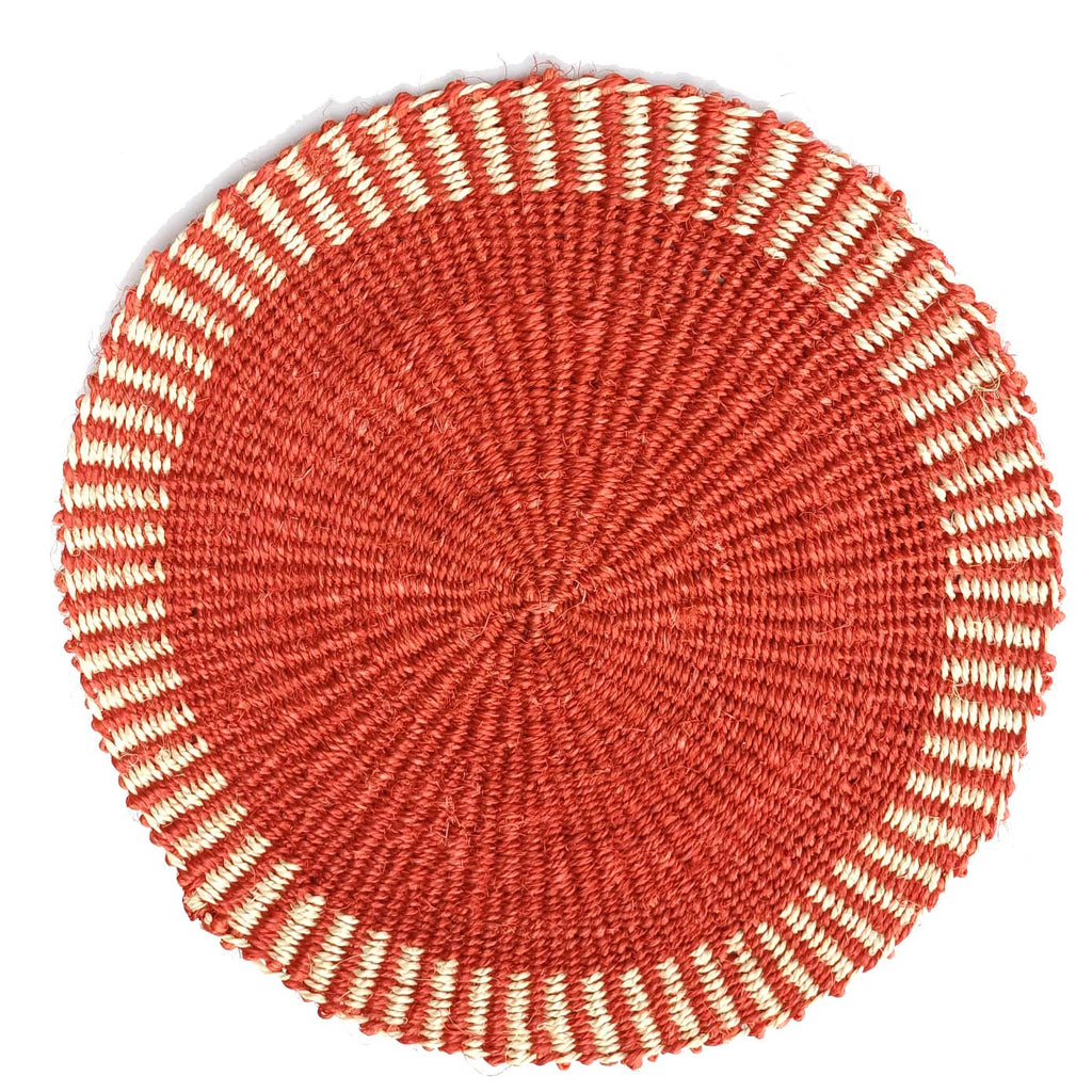 Round woven mat with concentric circle pattern on a white background