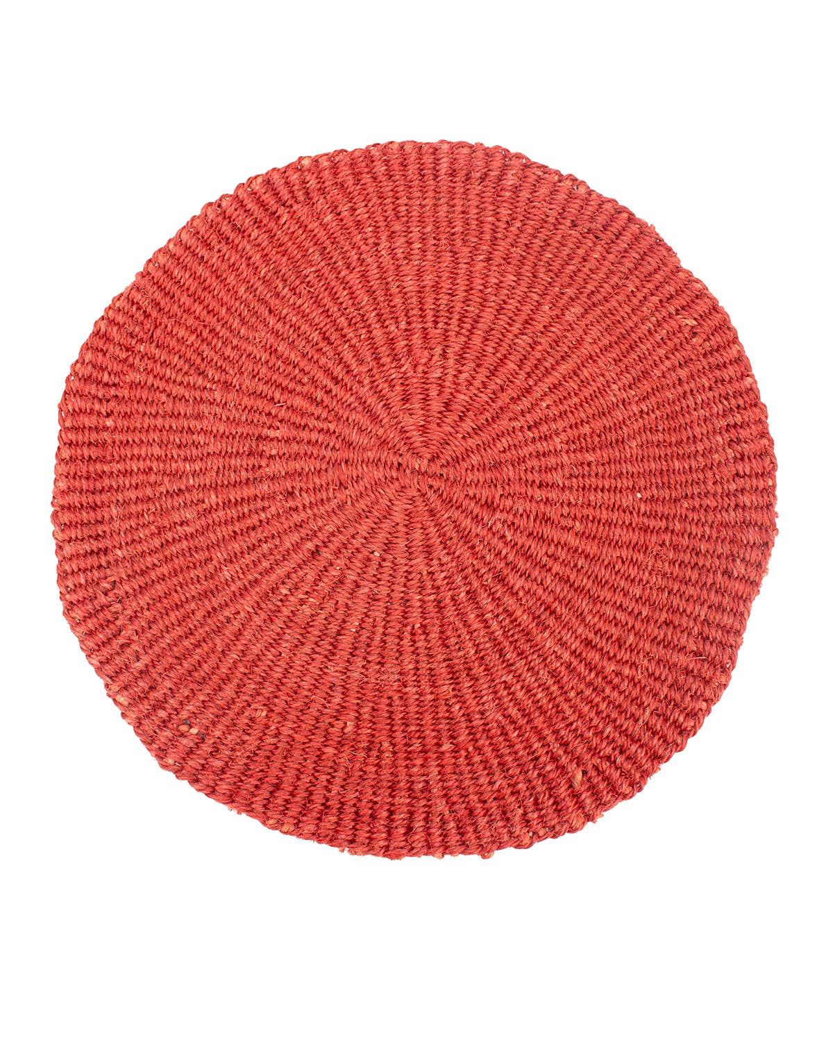 Round red woven placemat on a white background