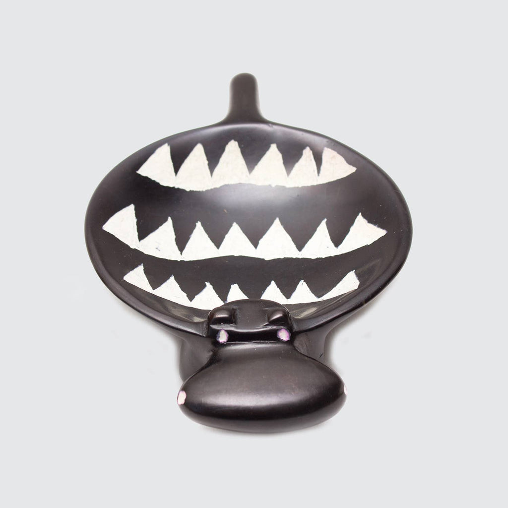 Black hippo dish on a light gray background