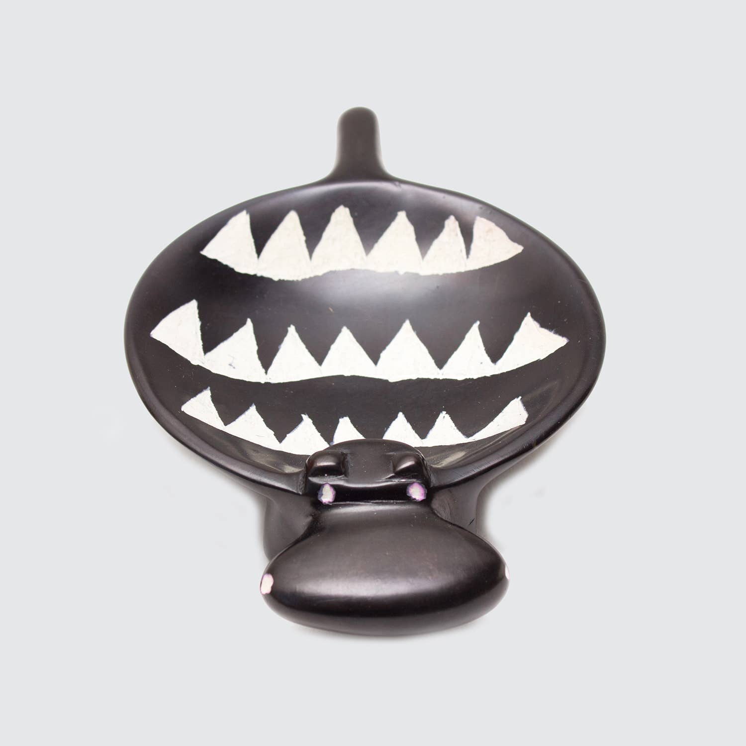 Black hippo dish on a light gray background