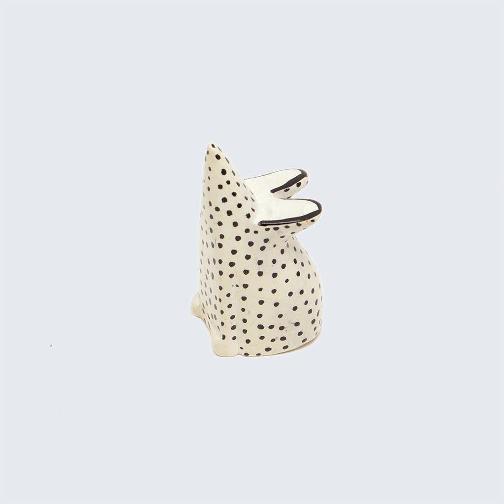 soapstone mouse with black dot pattern on a light gray background
