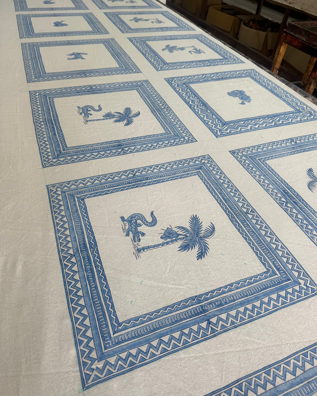 Tablecloth with blue geometric pattern on a white background