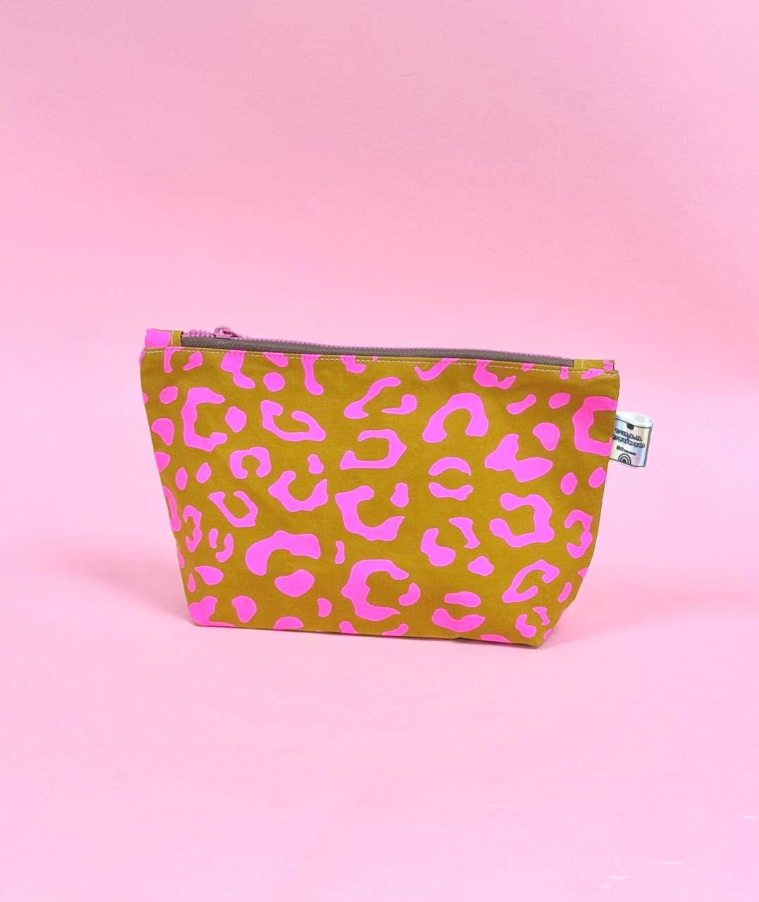 Pouch with pink leopard print on a pink background