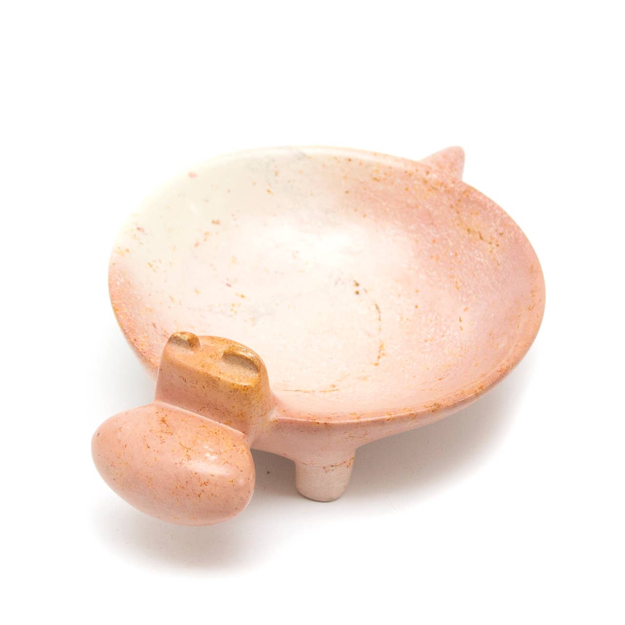 soapstone pink hippo figurine on a white background
