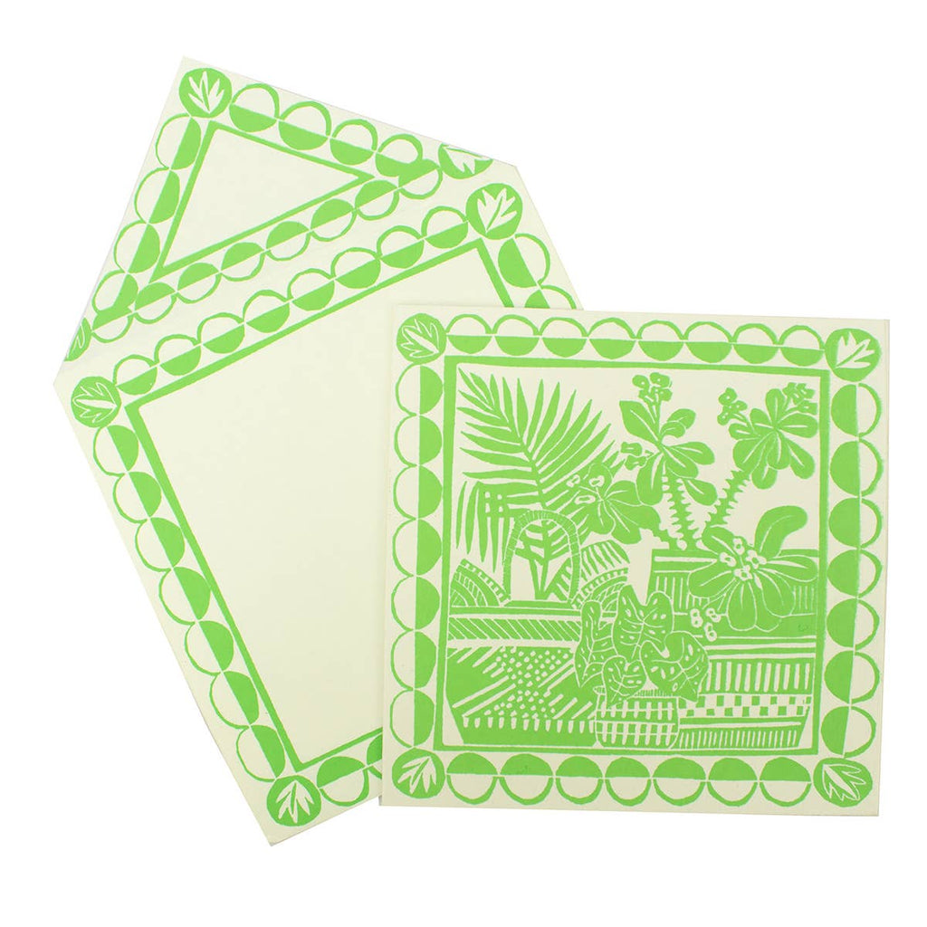 Two green patterned cards on a white background