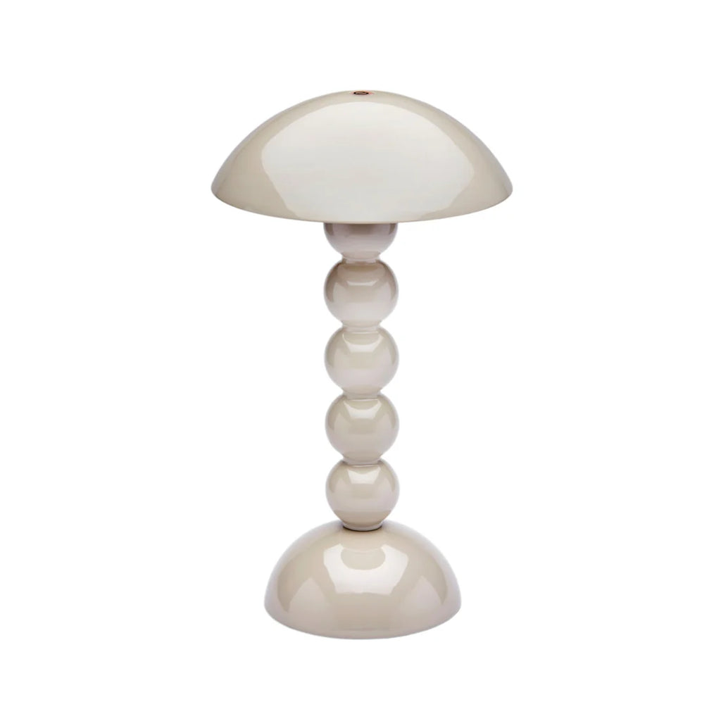 beige table lamp with a unique design on a white background
