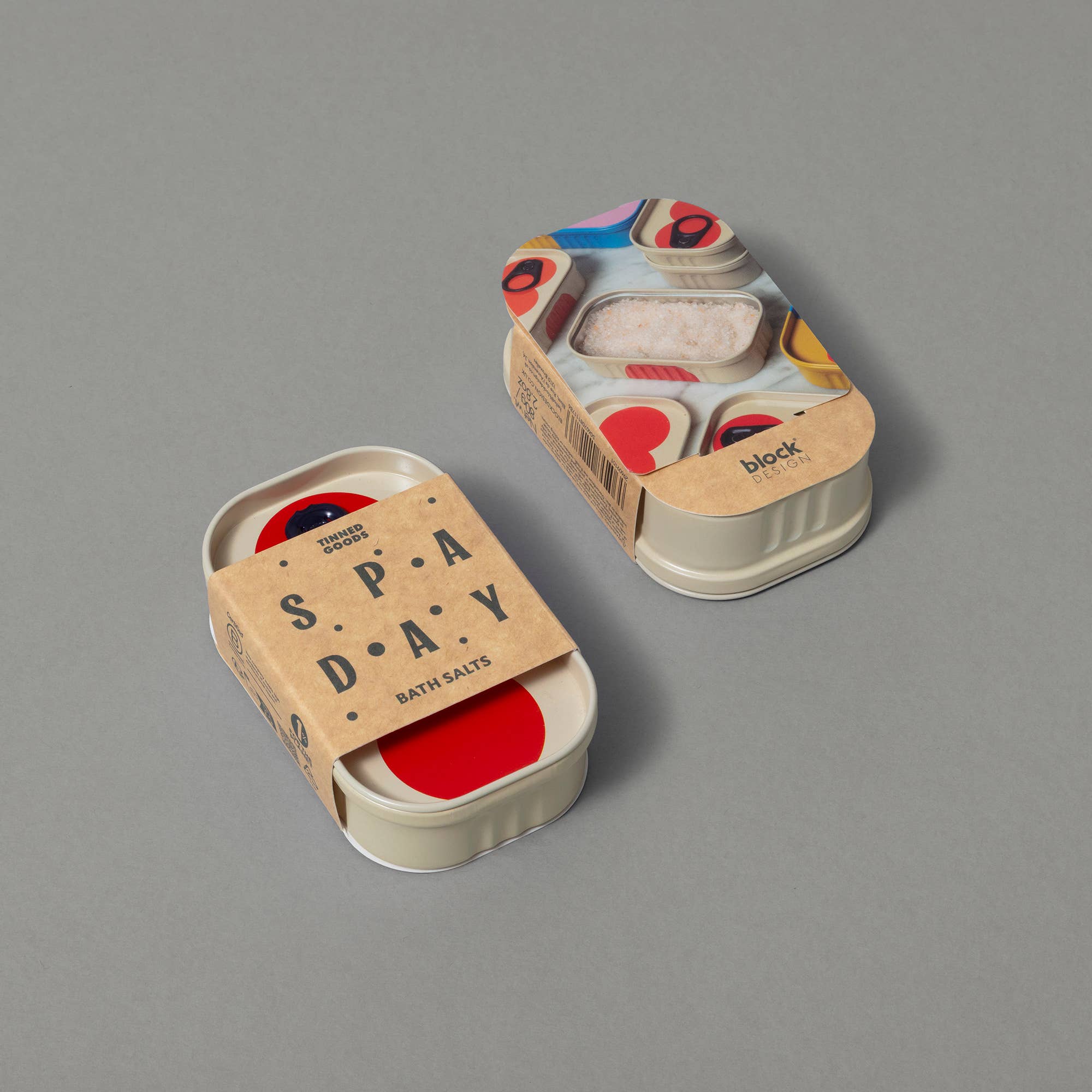 Two small containers with colorful labels on a gray background